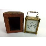 A Mappin & Webb French brass and beveled glass carriage clock in leather case,