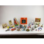 A selection of tinplate toys to include jumping zebra, cars, planes, Japanese elephant on bike etc.