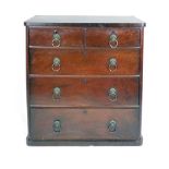A Victorian chest of two over three graduated drawers with brass lion mask handles
