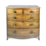 An early Victorian mahogany bow fronted chest of two over three graduated drawers on splay feet, h.