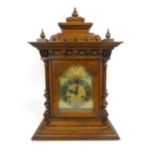 A late 19th century walnut and beech eight day double chime mantle clock,