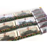 A selection of HO gauge flat car carriages, all carrying military vehicles to include tanks,