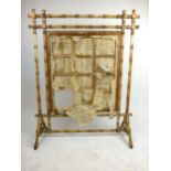 A Victorian painted faux bamboo fire screen with Chinese writing on paper panel, h. 119 cm, w.
