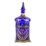 An Art Nouveau brass mounted decanter,