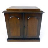 An early Victorian mahogany two door table cabinet,