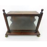 A mahogany display case on brass ball and claw feet, h. 20 cm, w. 29 cm, d.