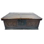 An early 18th century oak bible box, dated 1727, with carved initials 'G C' to the front, h.