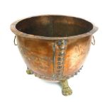 A 19th century and later copper and brass log basket, with lion mask handles and paw feet, h.