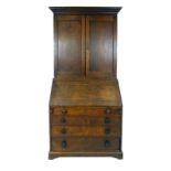An early 18th century oak bureau bookcase,