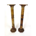 A pair of brown alabaster plinths with turned columns and octagonal bases, l. 97 cm, w. 22.5 cm, d.