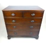 A George III mahogany chest of two over three graduated drawers on later bracket feet, h. 102 cm, w.