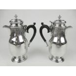 A pair of etched silver chocolate jugs, London 1927,