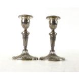 A pair of silver hallmarked candlesticks, Birmingham 1975, weighted, h.