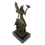 After Aldo Vitaleh, a modern bronze modeled as a fairy seated on a wall holding a butterfly, h.