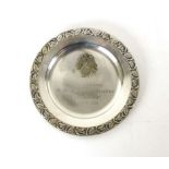 A Third Reich period plated presentation dish with brass eagle above swastika, engraved,