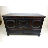 An early 18th century oak mule chest, the moulded top lifting to reveal a vacant interior,