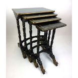 A 19th century Chinese black lacquered and parcel gilt quartetto nest of tables on turned reeded