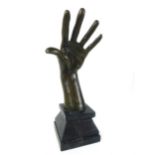 A modern bronze of abstract form, modeled as a hand and ear, with signature 'Milo' to the front,