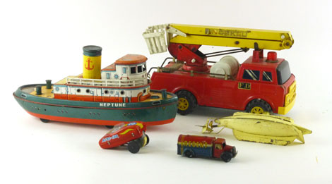 A collection of tinplate toys comprising of a wind up Neptune steam boat,