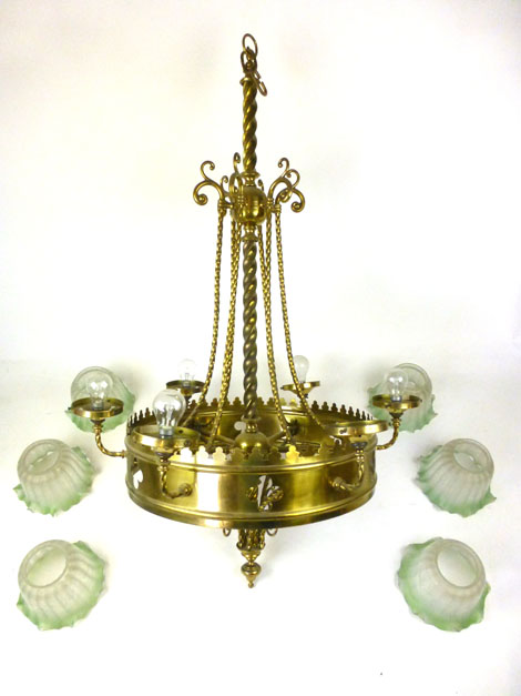 A late 19th century brass Gothic style six branch chandelier having six green etched glass shades,