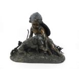 A 19th century bronze figural group of a young boy with a dog drinking from a scalloped shell,