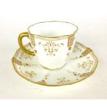 A 19th century Royal Crown Derby cup and saucer with gilt floral and bordered decoration,