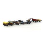 A collection of Hornby O gauge tinplate rolling stock including two Pullman coaches,