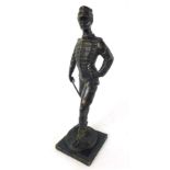 A 19th century bronze figure of a cavalry officer, holding a crop and gloves,