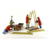 A collection of tinplate wind up toys comprising of two ladder climbing firemen (and one for parts)