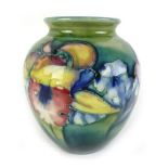 A mid-20th century Walter Moorcroft vase of baluster form, decorated in the 'Orchid' pattern,