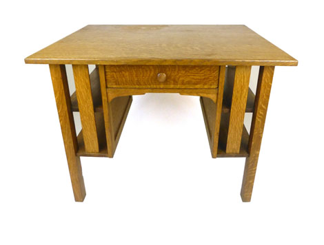An early 20th century quarter sawn oak kneehole desk by Stickley Brothers Furniture Company of