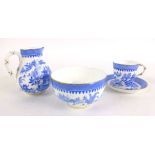 A Royal Worcester coffee cup and saucer, together with pouring jug and sugar bowl,