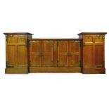 An Arts & Crafts oak, marquetry, and brass mounted sideboard,