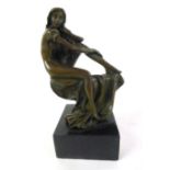 A modern stylized bronze of classical form, modeled as a nude seated on a flowing cloth,