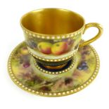 A Royal Worcester hand painted miniature cup, with still life decoration with signature,