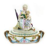 A 19th century French hand painted figural topped tureen and cover,