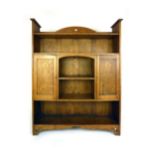 An Arts & Crafts oak and marquetry open bookcase,