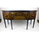 A Regency mahogany and ebony line inlaid bow fronted sideboard,