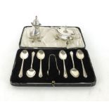 A cased set of six silver tea spoons and sugar tongs together with a silver hallmarked mustard pot