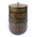 A ship's oak rum barrel of tapering form with applied brass inscription 'The Queen God Bless Her'