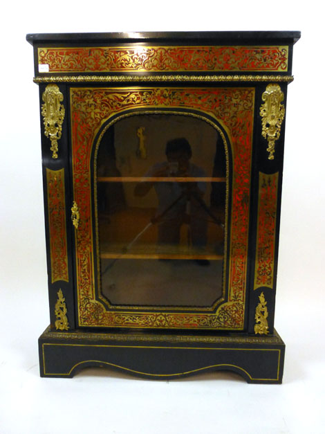 A 19th century French boulle work ebony and brass mounted vitrine/pier cabinet with single glazed