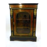 A 19th century French boulle work ebony and brass mounted vitrine/pier cabinet with single glazed
