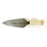 An African double edged dagger, with a carved ivory handle, blade l.