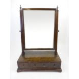 A late 18th century and later mahogany toilet mirror, with a three drawer base on bracket feet, h.