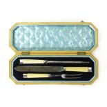 A Victorian mahogany cased silver and ivory mounted carving set,