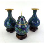 A Japanese 20th century lidded pot in the form of a pear, with blue and green foliate design,