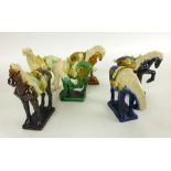 A collection of six Chinese Tang-type horses of various colours,