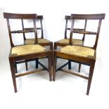 A set of four early 19th century mahogany dining chairs with rope twist bar backs on square