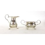 A silver hallmarked cream jug together with matching sugar bowl, Sheffield, weight approx.