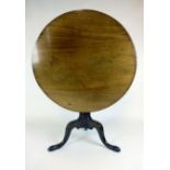 A mid 18th century mahogany tilt top tripod table,